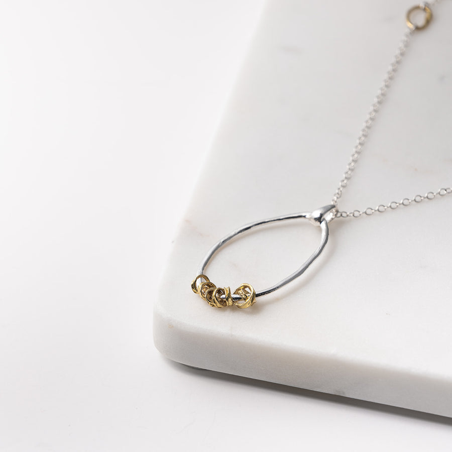 Oblong Pendant Necklace with Brass Rings